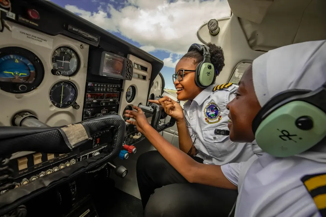 Alpha student pilots training inside a Cessna cockpit